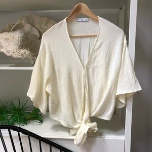 Mango crepe knit fabric wrap top.